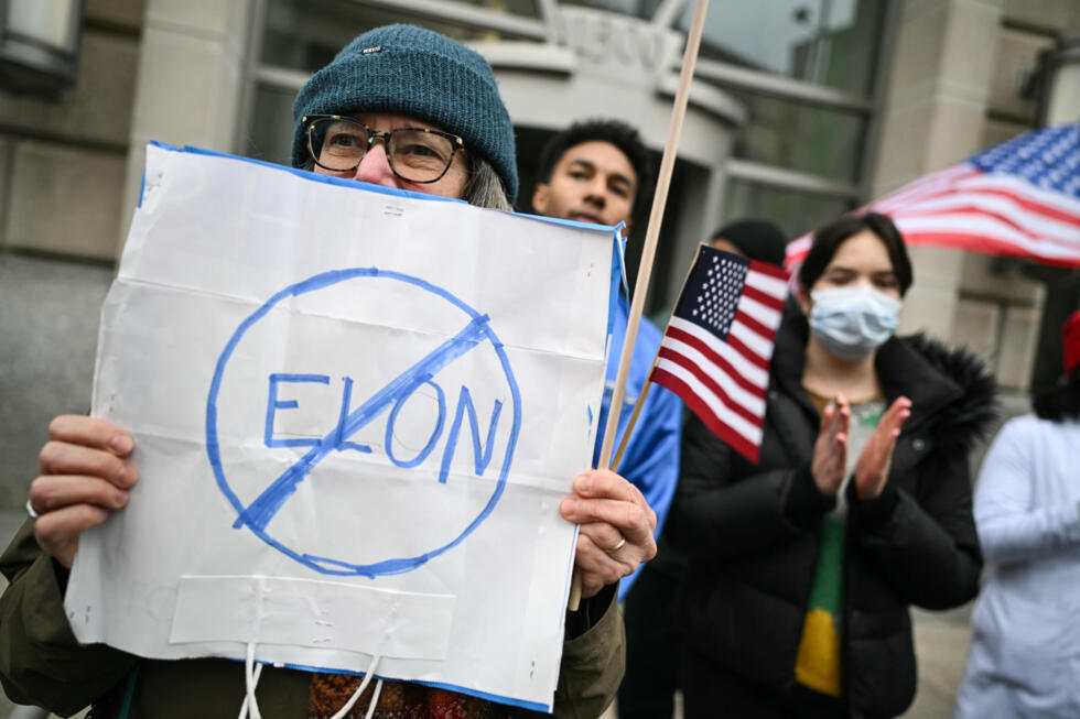 People protest outside the headquarters of the United States Agency for International Development in Washington, after tech giant Elon Musk announced the demise of the humanitarian agency