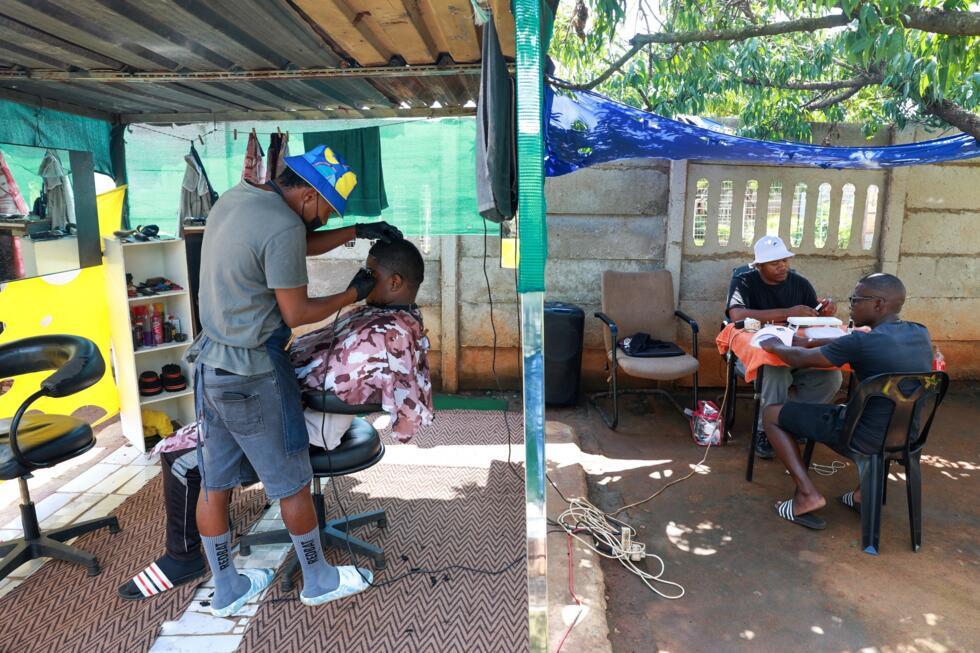 Moshoke's backyard barbershop includes a space for a self-styled nail technician